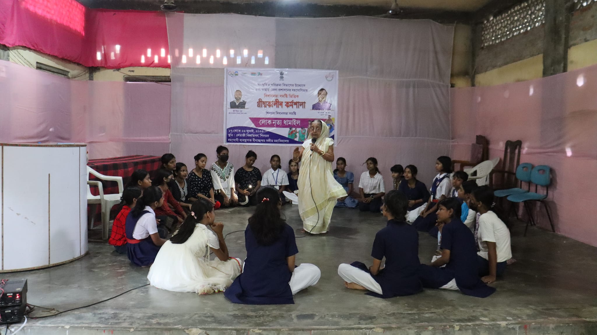 Youth learning tabla as part of BSMV's community-based cultural program in Silchar